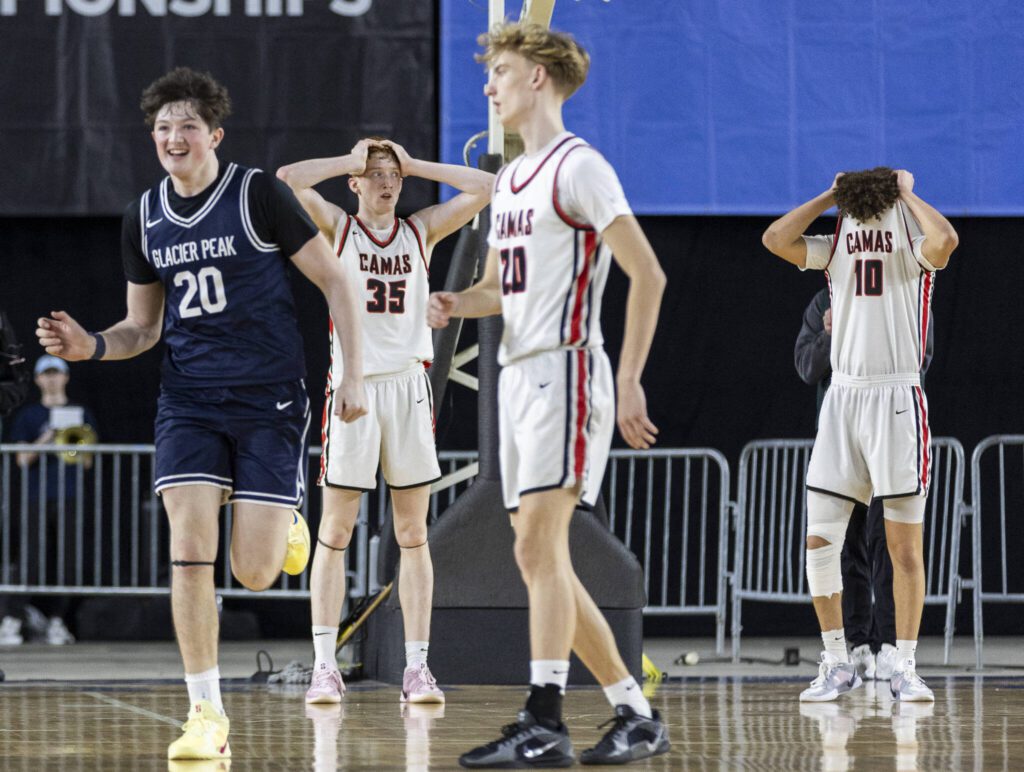 Camas players react to losing to Glacier Peak in the 4A boys quarterfinal game against Camas on Thursday, March 6, 2025 in Tacoma, Washington. (Olivia Vanni / The Herald)
