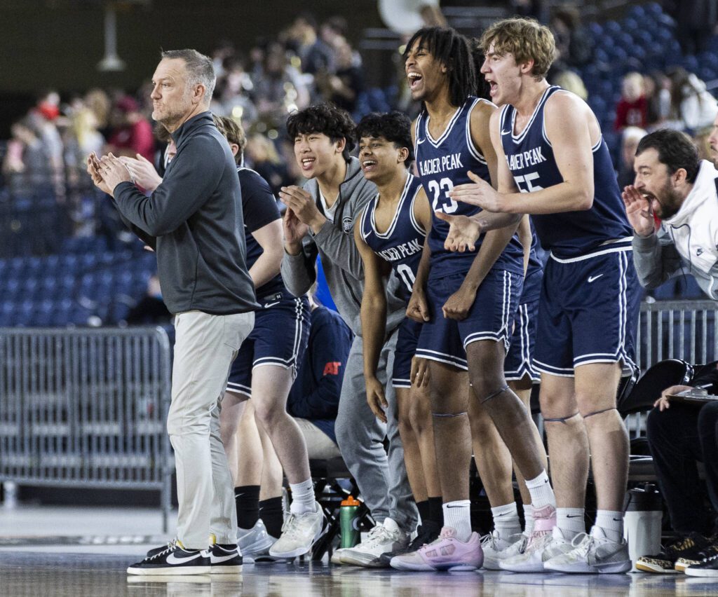 The Glacier Peak bench reaches to a 3-point shot during the 4A boys quarterfinal game against Camas on Thursday, March 6, 2025 in Tacoma, Washington. (Olivia Vanni / The Herald)
