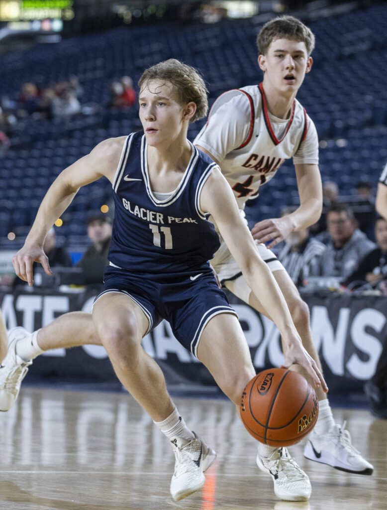 Glacier Peak’s Reed Nagel looks for an open lane to the basket during the 4A boys quarterfinal game against Camas on Thursday, March 6, 2025 in Tacoma, Washington. (Olivia Vanni / The Herald)
