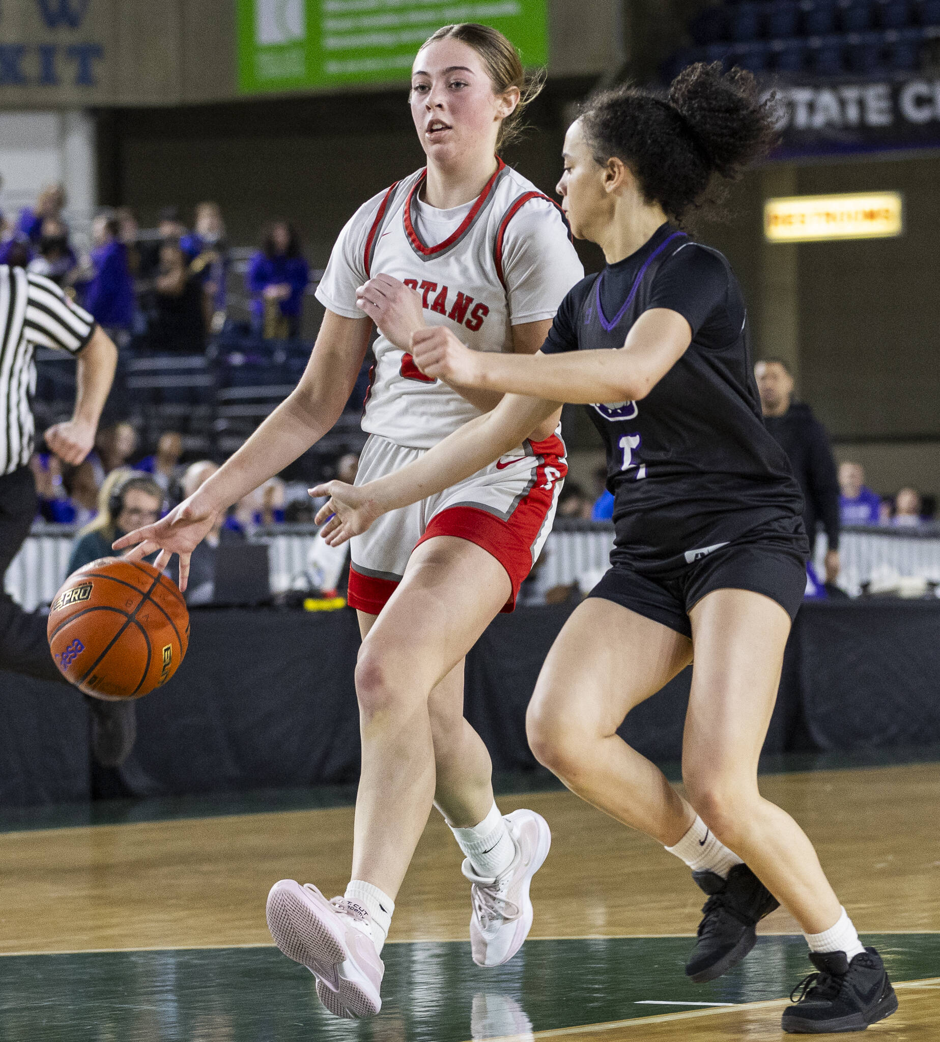 Stanwood’s Ellalee Wortham takes the ball down the court during the 3A girls quarterfinal game against Garfield on Thursday, March 6, 2025 in Tacoma, Washington. (Olivia Vanni / The Herald)