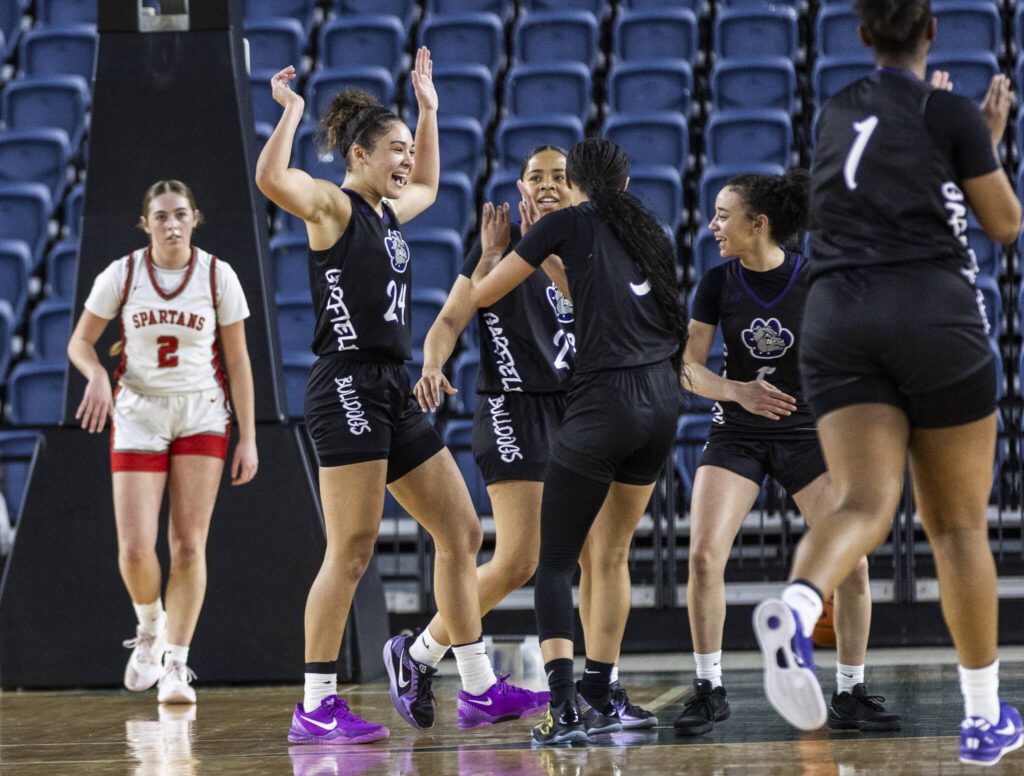 Garfield players celebrate Stanwood calling a timeout during the 3A girls quarterfinal game against Garfield on Thursday, March 6, 2025 in Tacoma, Washington. (Olivia Vanni / The Herald)
