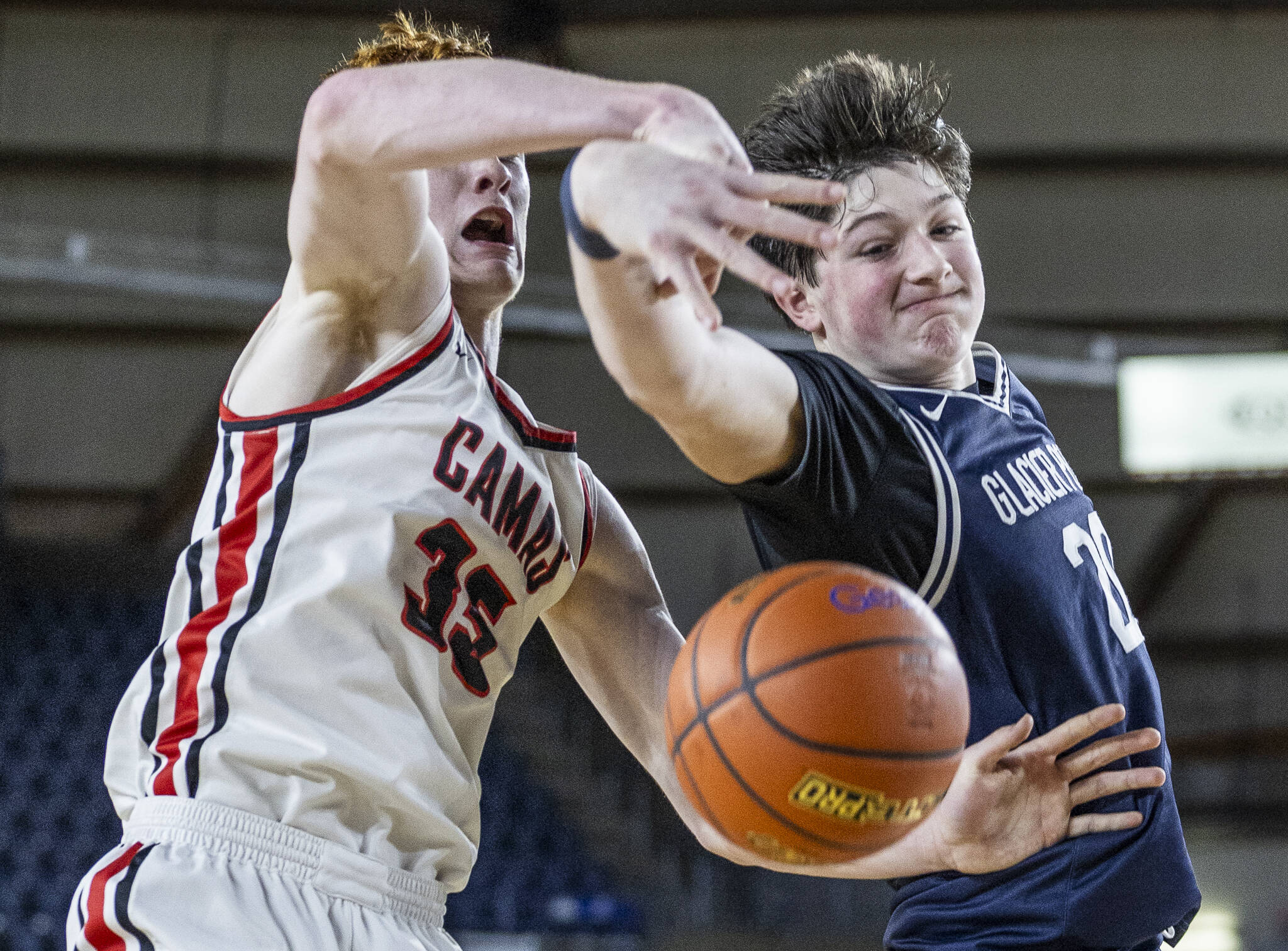 Glacier Peak’s Zachary Albright reaches out for a rebound during the 4A boys quarterfinal game against Camas on Thursday, March 6, 2025 in Tacoma, Washington. (Olivia Vanni / The Herald)