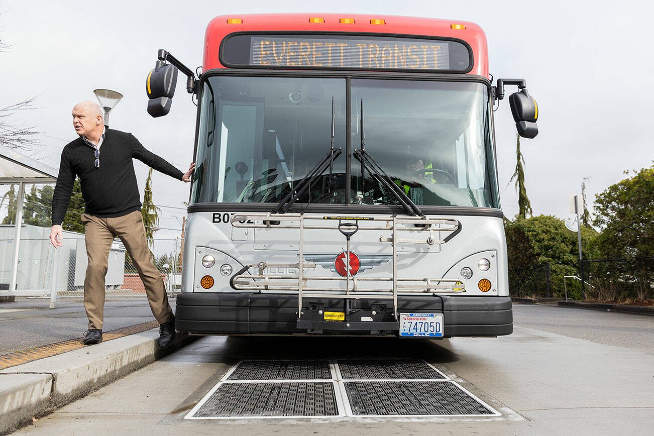 Everett Transit Director Mike Schmieder talks about how the buses are able to lower themselves onto the induction chargers on Monday, March 10, 2025 in Everett, Washington. (Olivia Vanni / The Herald)