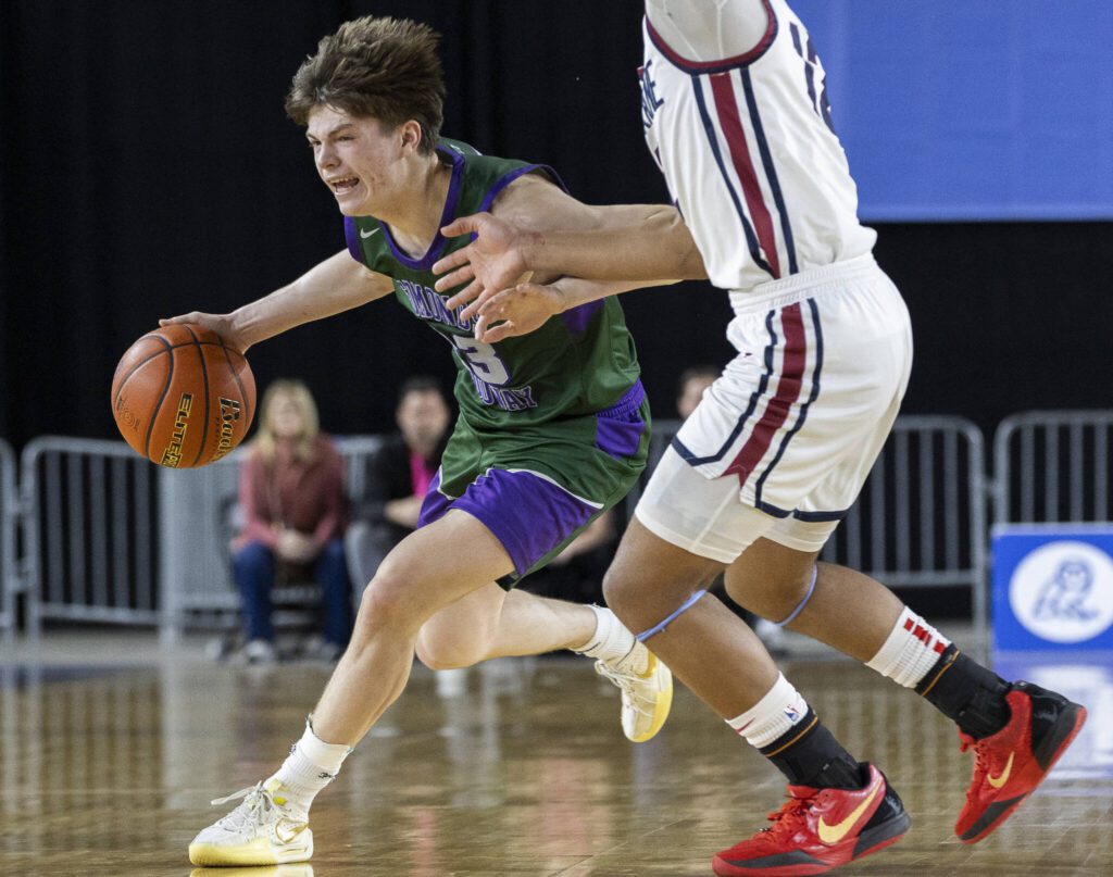 Edmonds-Woodway’s DJ Karl takes the ball down the court during the 3A boys semifinal game against Mt. Spokane on Friday, March 7, 2025 in Tacoma, Washington. (Olivia Vanni / The Herald)
