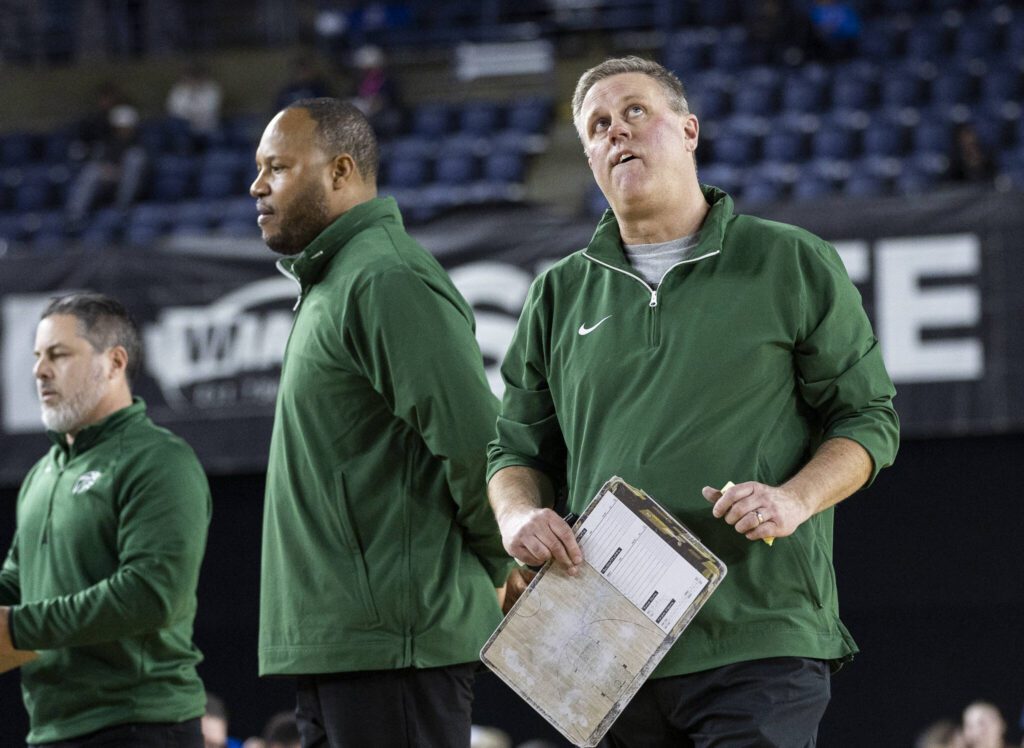 Edmonds-Woodway head coach Tyler Geving looks up at the score board during the 3A boys semifinal game against Mt. Spokane on Friday, March 7, 2025 in Tacoma, Washington. (Olivia Vanni / The Herald)
