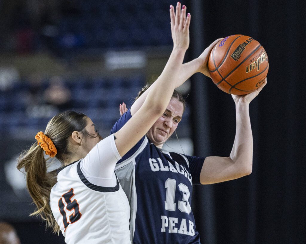 Glacier Peak’s Samantha Thoma tries to keep possession of the ball during the 4A girls semifinal game against Davis on Friday, March 7, 2025 in Tacoma, Washington. (Olivia Vanni / The Herald)
