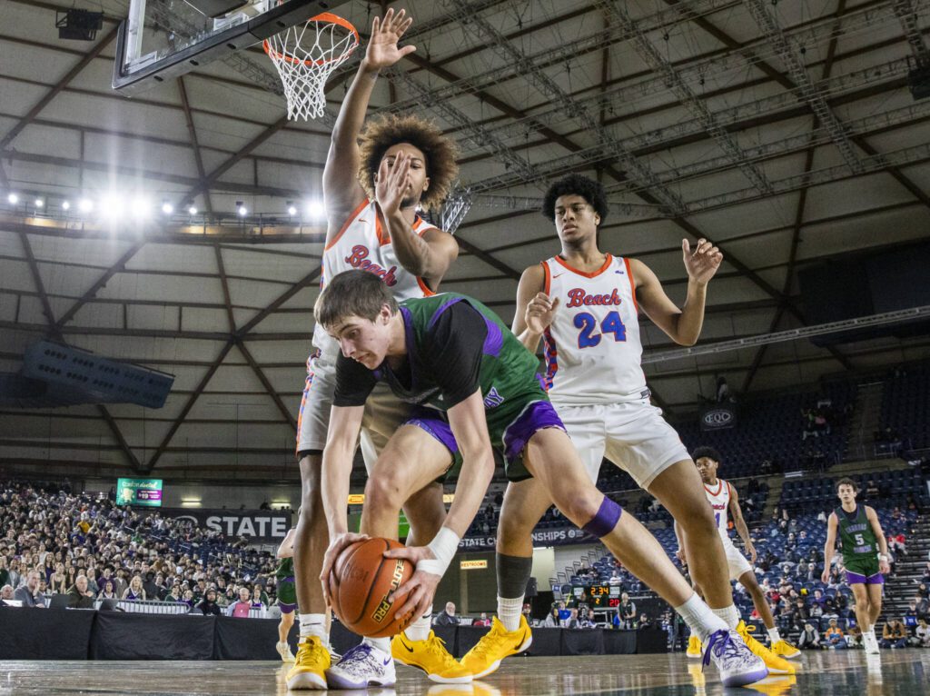 Edmonds-Woodway’s William Alseth grabs a loose ball under the basket during the 3A boys championship game against Rainier Beach on Saturday, March 8, 2025 in Tacoma, Washington. (Olivia Vanni / The Herald)
