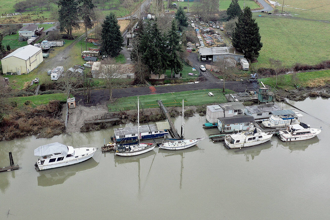Boats docked along Steamboat Slough of the Snohomish River on the north side of Ebey Island, just south of Spencer Island Park. This view is looking south. (Chuck Taylor / The Herald) 20200109