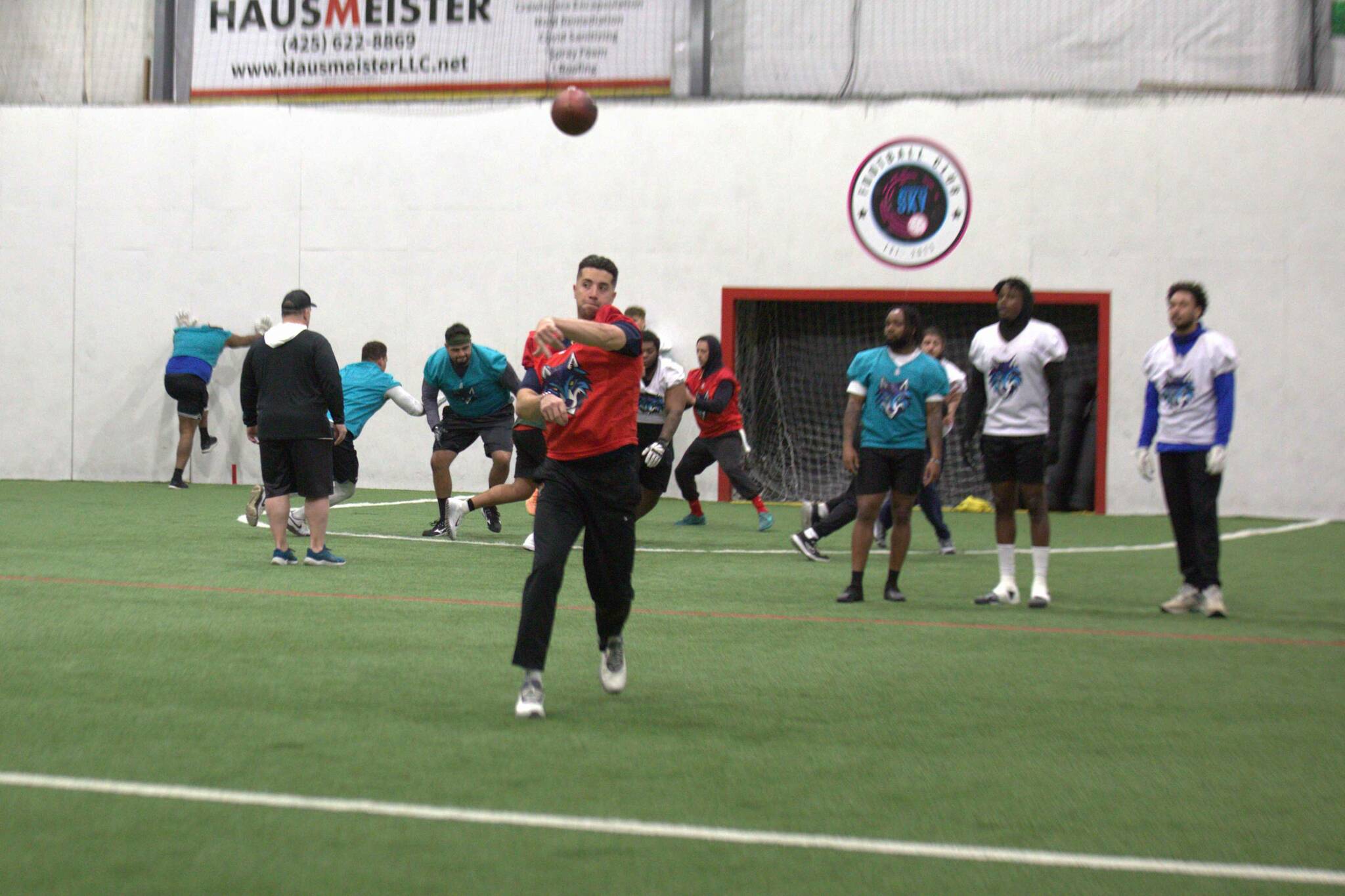 Washington Wolfpack quarterback Joe Hess throws a pass during the Arena Football One team's practice at Snohomish Sports Dome on Thursday, March 13, 2025. (Aaron Coe / The Herald)