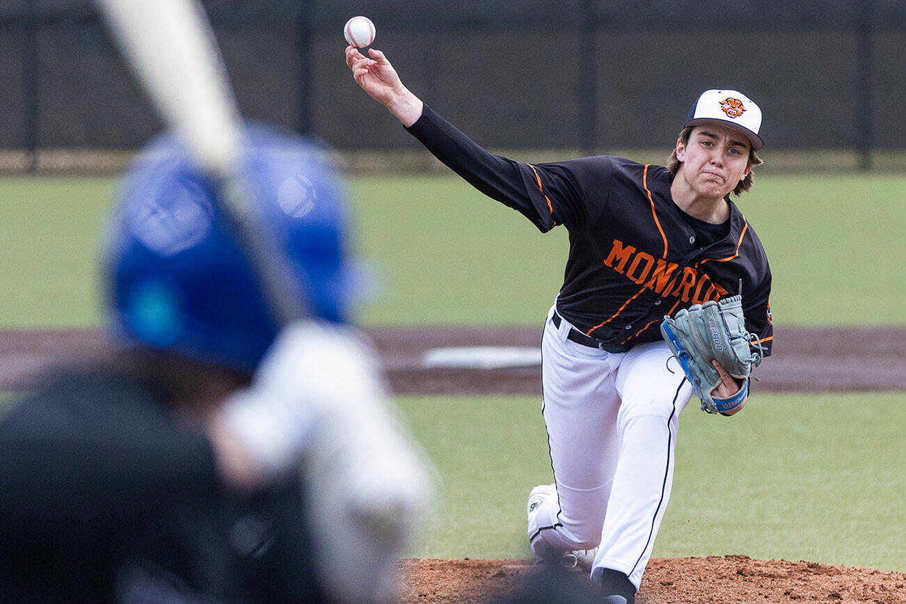 Monroe’s AJ Welch throws a pitch during the game against Kamiak on Friday, March 14, 2025 in Monroe, Washington. (Olivia Vanni / The Herald)