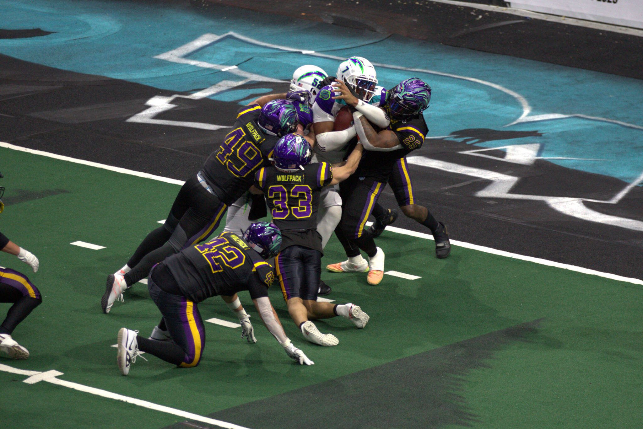 Southwest Kansas Storm quarterback Jalen Morton (7) bulls his way into the end zone on fourth down in the first quarter of the Washington Wolfpack’s 63-33 loss at Angel of the Winds Arena on March 16, 2025. (Aaron Coe / The Herald)