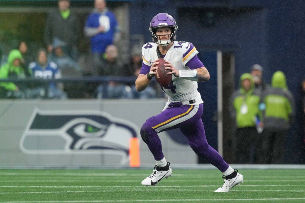 While with the Minnesota Vikings, Sam Darnold looks to throw a pass against the Seattle Seahawks at Lumen Field on Dec. 22, 2024. (Christopher Mast / Getty Images / The Athletic)