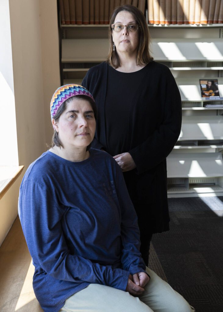 Emerson Elementary School student parents Dana Sanders and Jennifer Phillips McLellan at the Everett Public Library on Wednesday, April 16, 2025 in Everett, Washington. (Olivia Vanni / The Herald)
