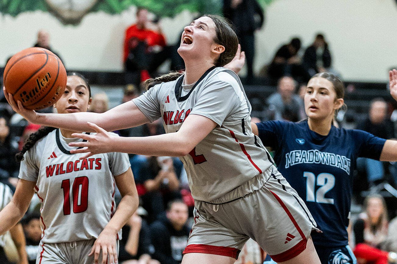 Archbishop Murphy’s Brooke Blachly is fouled while making a layup during the game against Meadowdale on Thursday, Jan. 30, 2025 in Everett, Washington. (Olivia Vanni / The Herald)