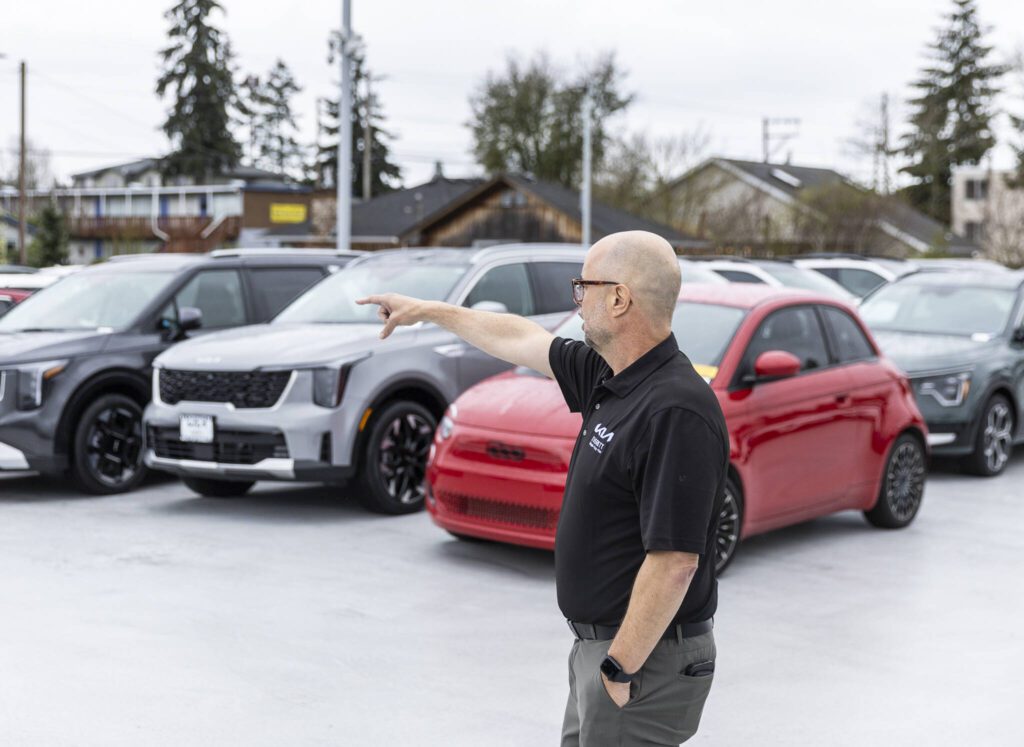 Sales Manger Erik Butler talks about their inventory at Kia of Everett on Tuesday, April 1, 2025 in Everett, Washington. (Olivia Vanni / The Herald)
