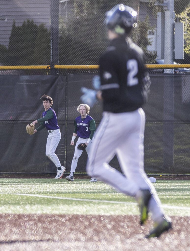 Edmonds-Woodway’s Toshi Gilginas makes a diving catch in the outfield and celebrates with teammate Lukas Wanke during the game against Jackson on Wednesday, April 2, 2025 in Edmonds, Washington. (Olivia Vanni / The Herald)
