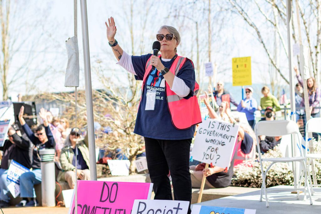 Naomi Dietrich, founder and co-leader of Snohomish Indivisible, speaks to the crowd on the county campus in Everett. Saturday, April 5, 2025 in Everett, Washington. (Aaron Kennedy / The Herald)
