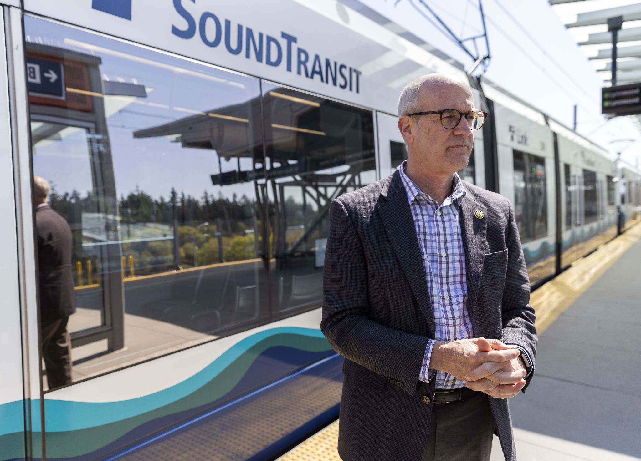 A SoundTransit Link train pulls into the Mountlake Terrace station as U.S. Rep. Rick Larsen, D-Everett, talks about the T&I Committee’s work on the surface reauthorization bill on Wednesday, April 16, 2025 in Mountlake Terrace, Washington. (Olivia Vanni / The Herald)