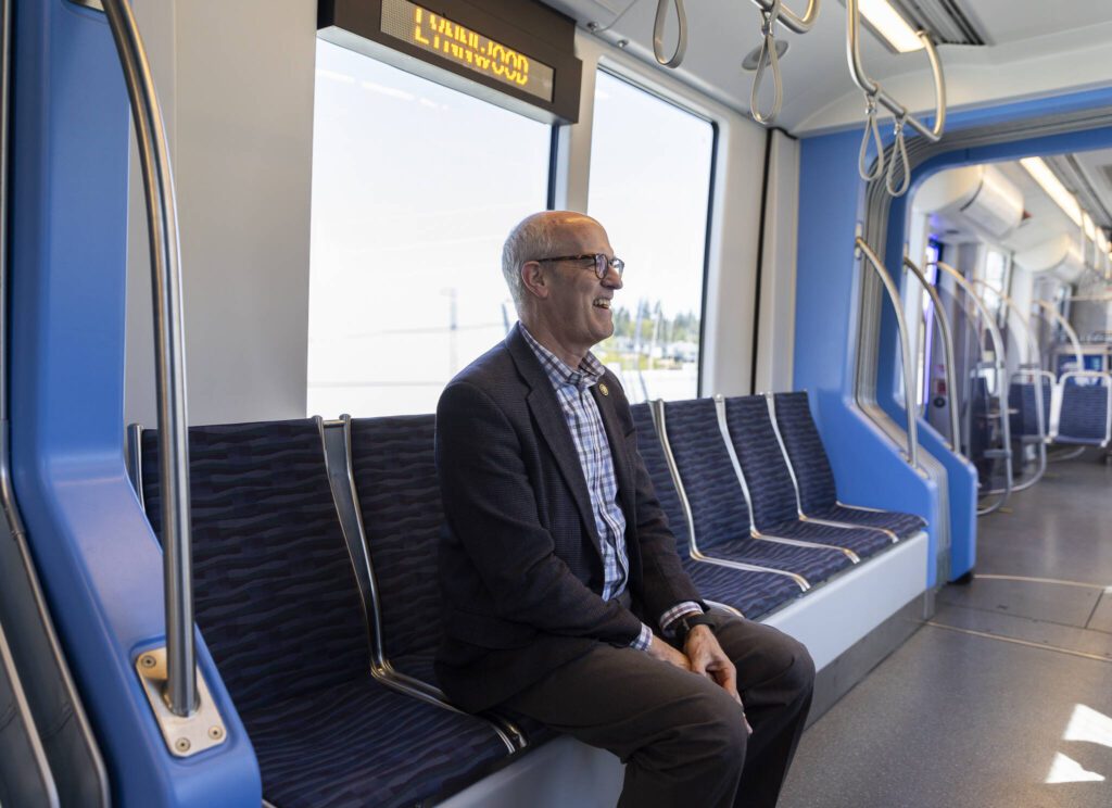 U.S. Rep. Rick Larsen, D-Everett, rides the SoundTransit Link train to Lynnwood Station on Wednesday, April 16, 2025 in Mountlake Terrace, Washington. (Olivia Vanni / The Herald)

