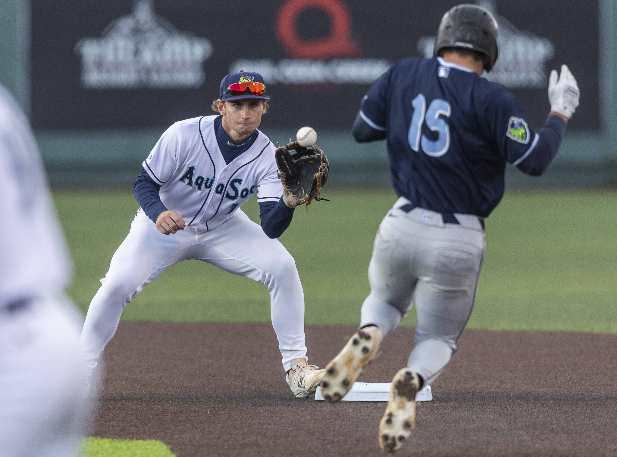 Everett AquaSox shortstop Colt Emerson catches the ball at second base for the first out in a double play during the Opening Day game against the Hillsboro Hops on Tuesday, April 8, 2025 in Everett, Washington. (Olivia Vanni / The Herald)