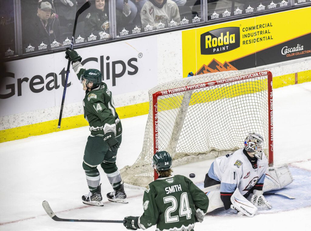 Everett Silvertips’ forward Austin Roest raises his stick in the air incelebrationa after scoring a goal during a power play to tie up the game during the second round WHL playoff game against the Portland Winterhawks on Friday, April 11, 2025 in Everett, Washington. (Olivia Vanni / The Herald)
