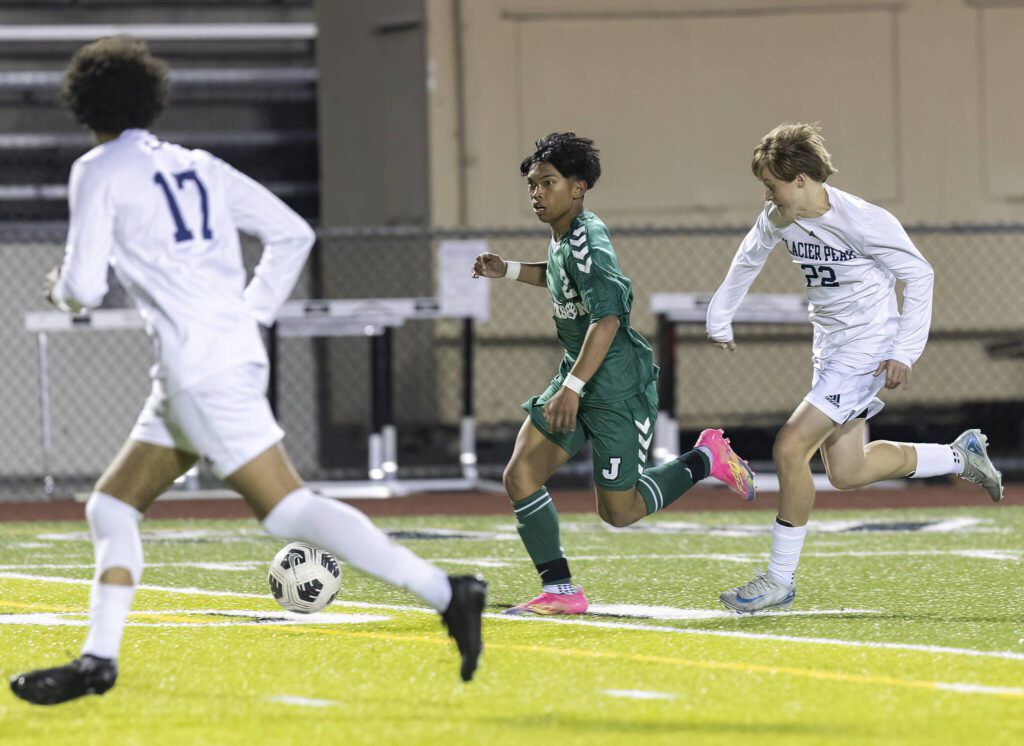 Jackson’s Isaiah Natividad takes the ball down the field during the game against Glacier Peak on Tuesday, April 15, 2025 in Everett, Washington. (Olivia Vanni / The Herald)
