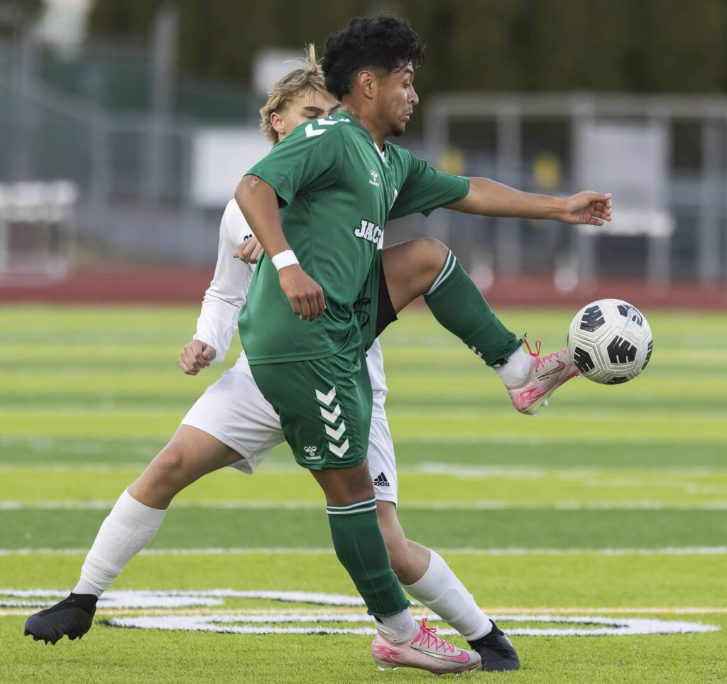 Jackson’s Anthony Gonzales-Marroquin jumps in the air to trap the ball during the game against Glacier Peak on Tuesday, April 15, 2025 in Everett, Washington. (Olivia Vanni / The Herald)
