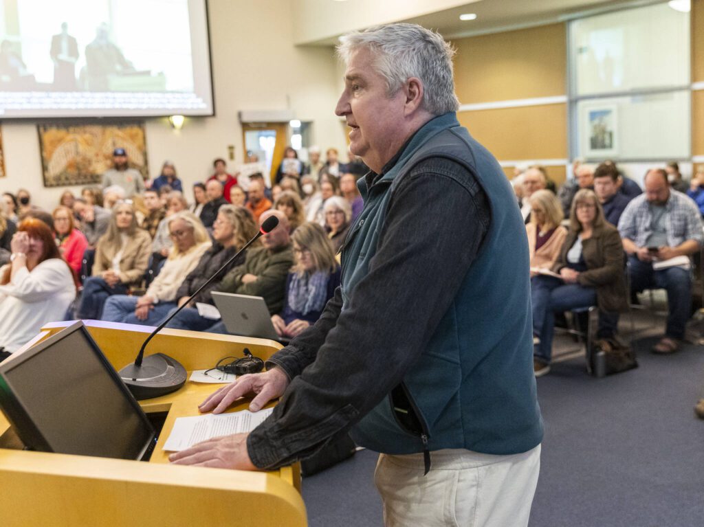 Dave Millette speaks out against a proposed Medical District Expansion near Swedish Edmonds at the city council meeting on Monday, April 21, 2025 in Edmonds, Washington. (Olivia Vanni / The Herald)
