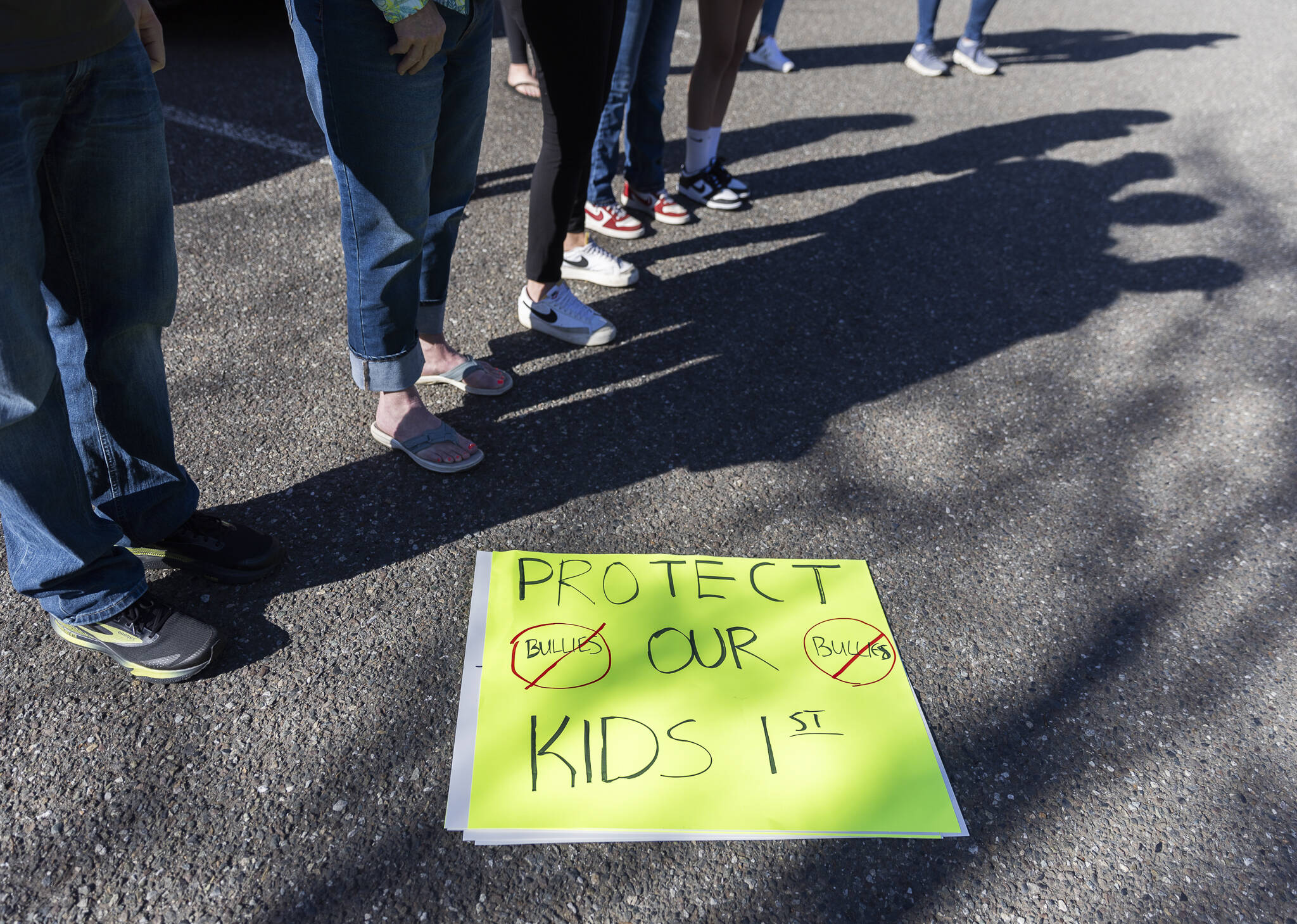 Over a dozen parents and some Snohomish School District students gather outside of the district office to protest and discuss safety concerns after an incident with a student at Machias Elementary School on Friday, April 18, 2025 in Snohomish, Washington. (Olivia Vanni / The Herald)