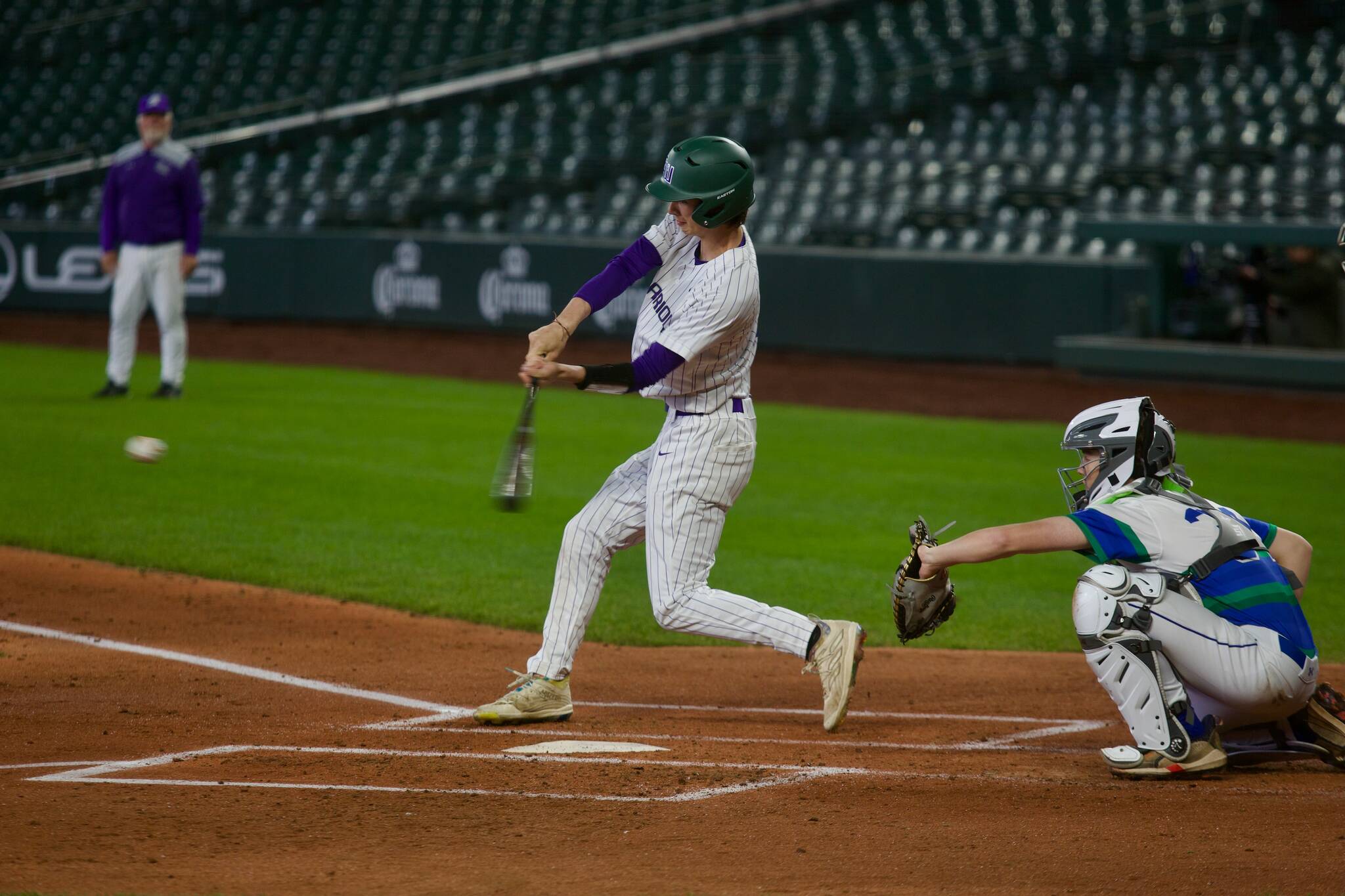 Edmonds-Woodway senior Luke Boland takes a swing during the Warriors' 3-0 win against Liberty (Renton) at T-Mobile Park in Seattle, Washington on April 19, 2025. (Joe Pohoryles / The Herald)