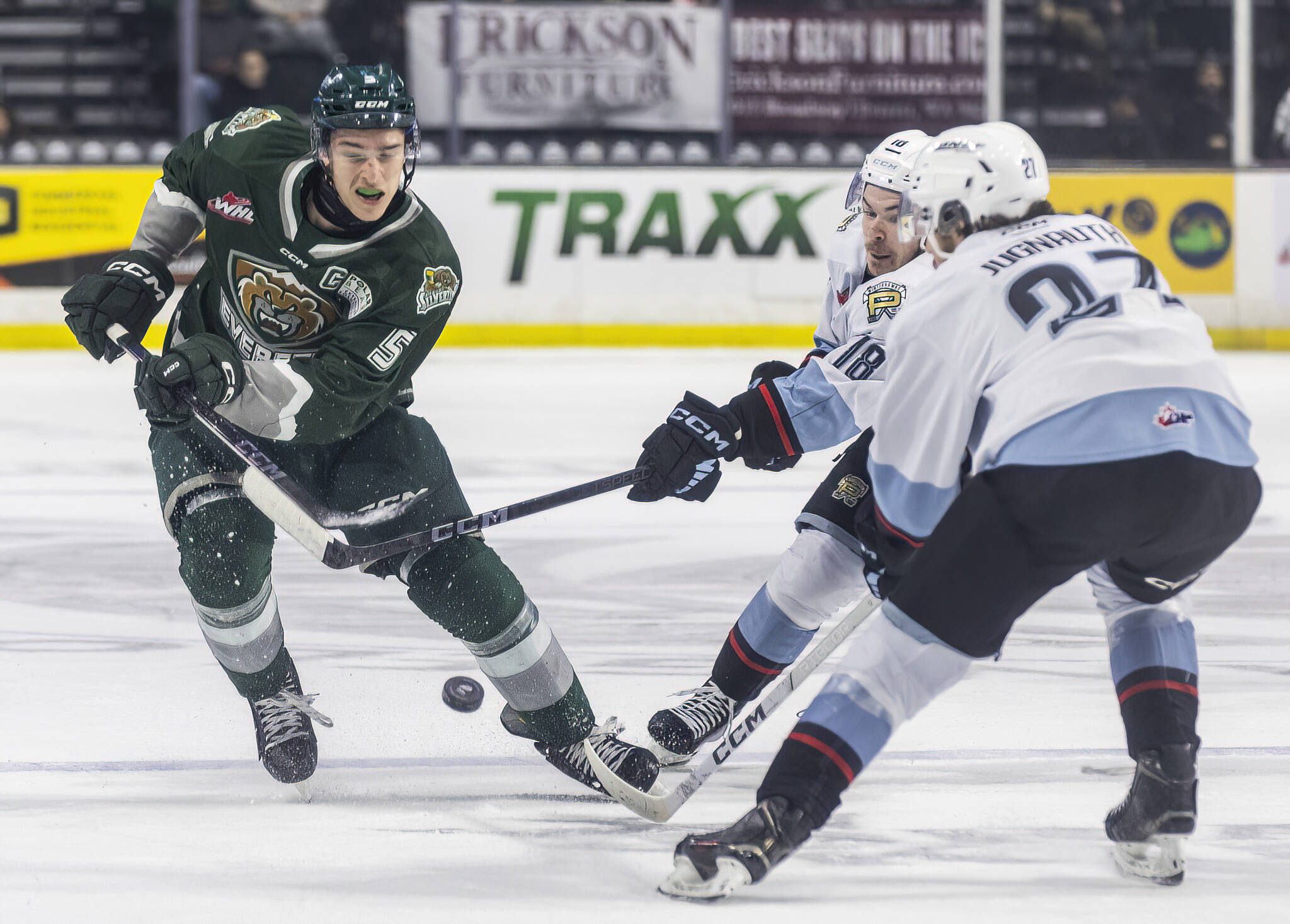 Everett Silvertips’ defenseman Eric Jamieson maneuvers around the outstretched stick of Portland Winterhawks’ Kyle McDonough during game seven of the second round of the WHL playoffs on Tuesday, April 22, 2025 in Everett, Washington. (Olivia Vanni / The Herald)