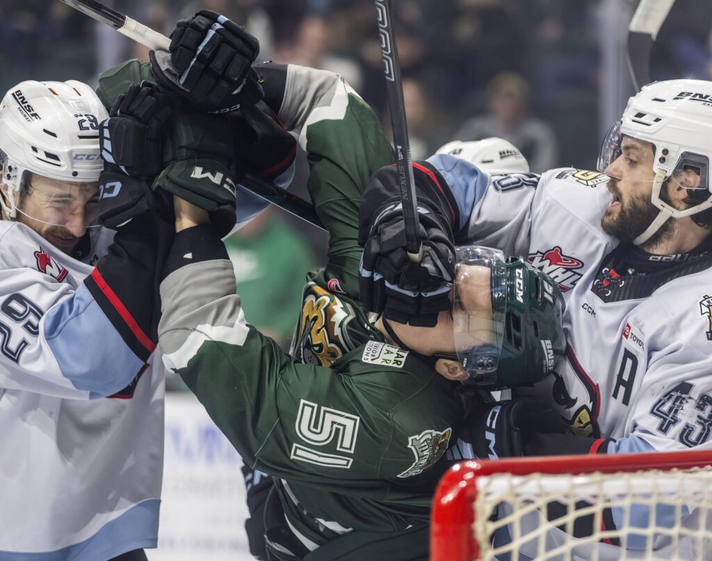 Everett Silvertips’ forward Jaxsin Vaughan gets hit in the face during game seven of the second round of the WHL playoffs against the Portland Winterhawks on Tuesday, April 22, 2025 in Everett, Washington. (Olivia Vanni / The Herald)
