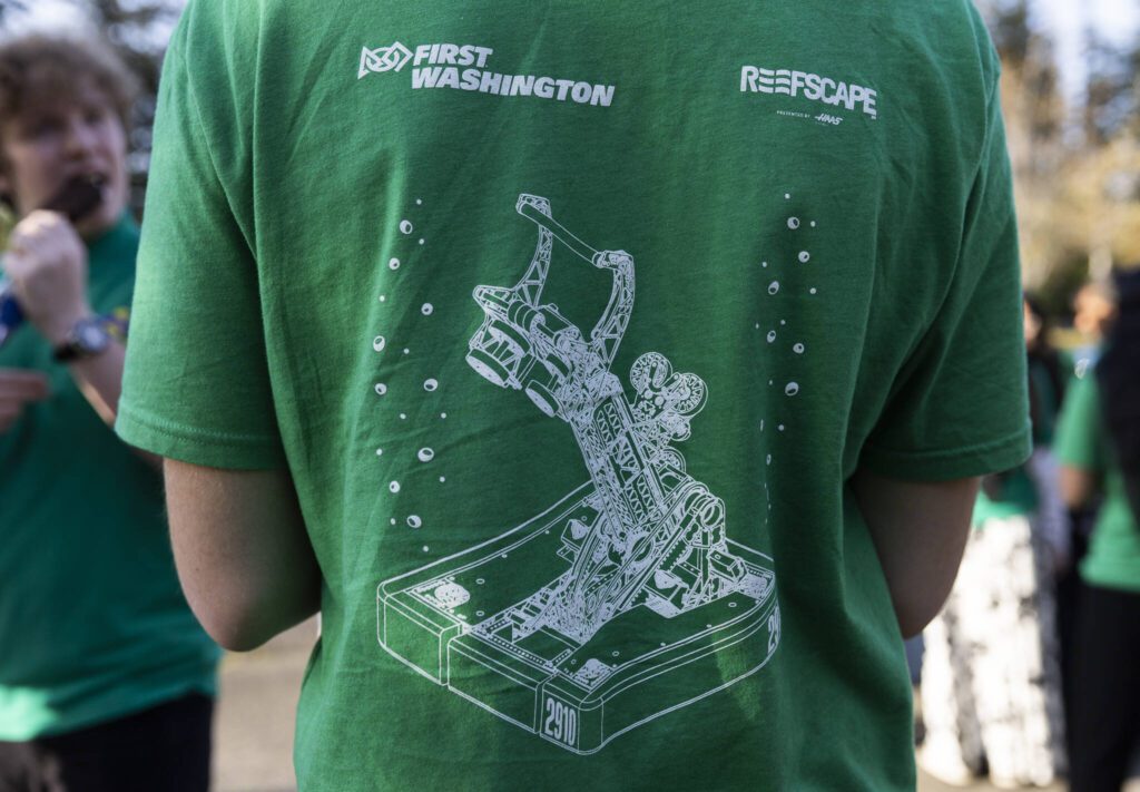 The base model of the Team 2910 Jack in the Bot’s robot displayed on the back of a shirt on Thursday, April 24, 2025 in Mill Creek, Washington. (Olivia Vanni / The Herald)
