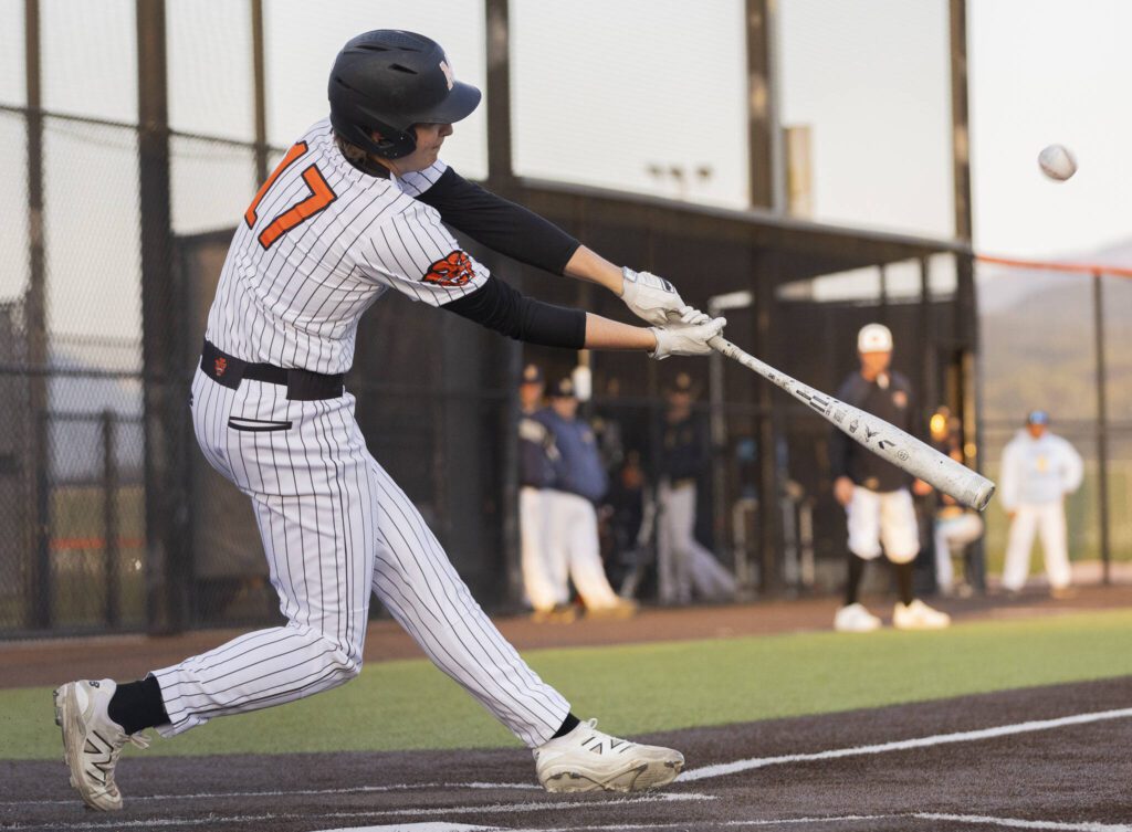 Monroe’s AJ Welch gets a hit during the game against Everett on Wednesday, April 23, 2025 in Monroe, Washington. (Olivia Vanni / The Herald)
