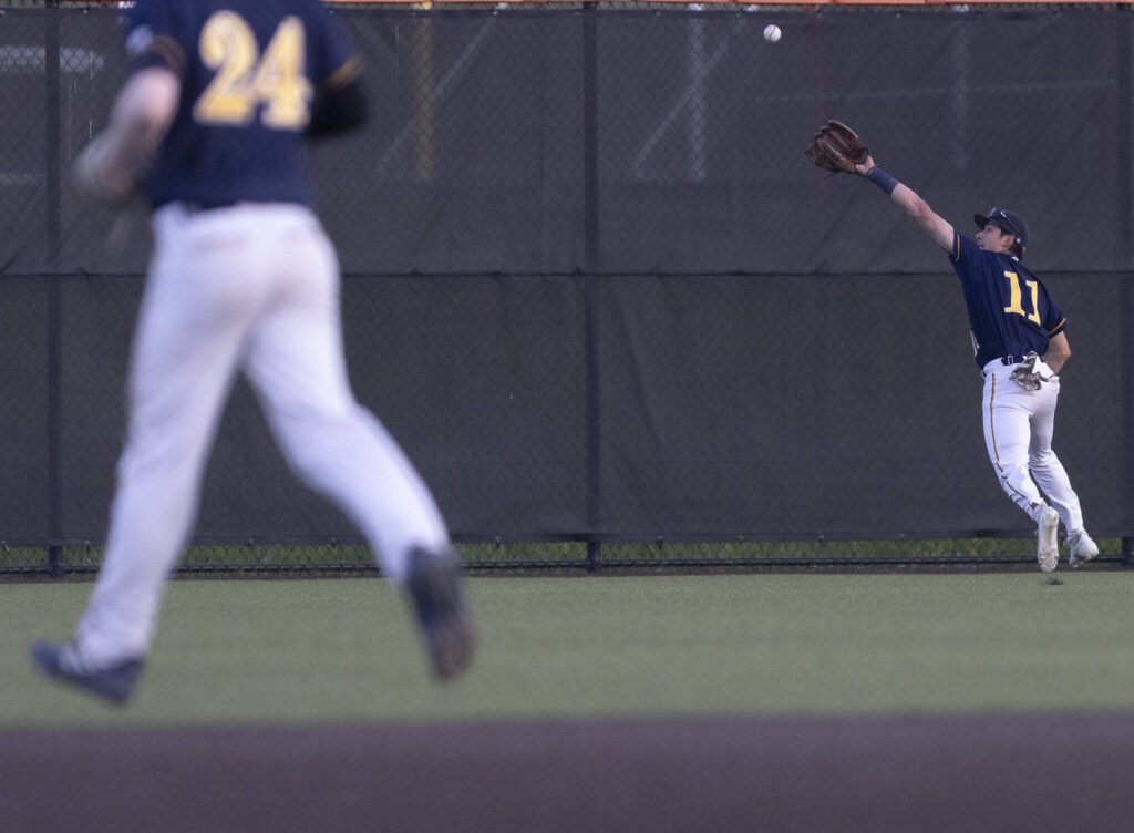 Everett’s Andreas Gutierrez misses a catch in the outfield during the game against Monroe on Wednesday, April 23, 2025 in Monroe, Washington. (Olivia Vanni / The Herald)

