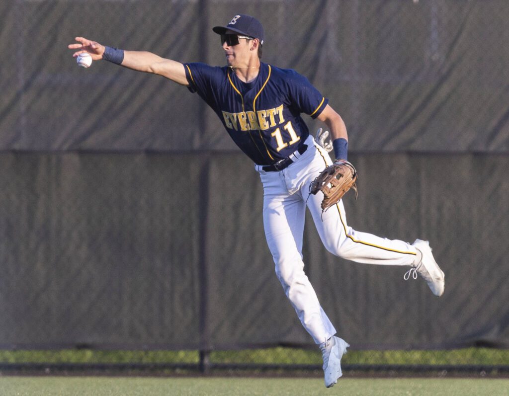 Everett’s Andreas Gutierrez reaches out to catch the ball off a bounce in the outfield during the game against Monroe on Wednesday, April 23, 2025 in Monroe, Washington. (Olivia Vanni / The Herald)
