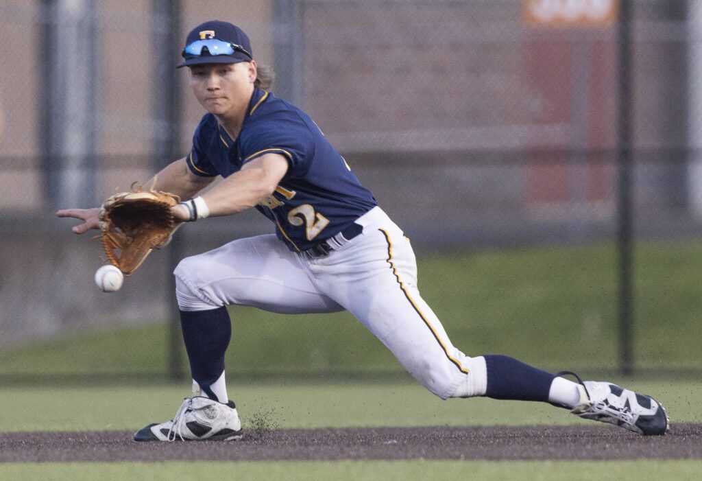 Everett’s Mac Larsen fields the ball during the game against Monroe on Wednesday, April 23, 2025 in Monroe, Washington. (Olivia Vanni / The Herald)
