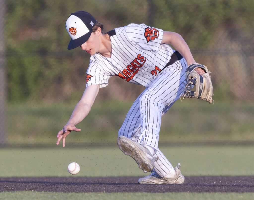 Monroe’s Gavin Prescott reaches out to grab the ball after missing the catch during the game against Everett on Wednesday, April 23, 2025 in Monroe, Washington. (Olivia Vanni / The Herald)
