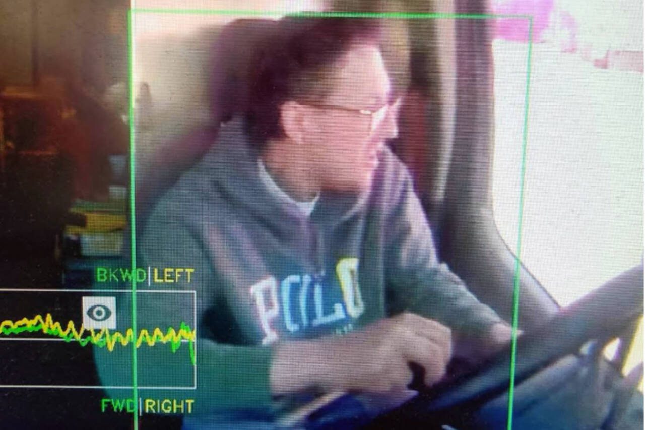 The suspect is pictured wearing a gray hoodie with “POLO” written in white lettering, a white T-shirt underneath and glasses, according to a social media post. (Photo courtesy Snohomish County Sheriff’s Office)