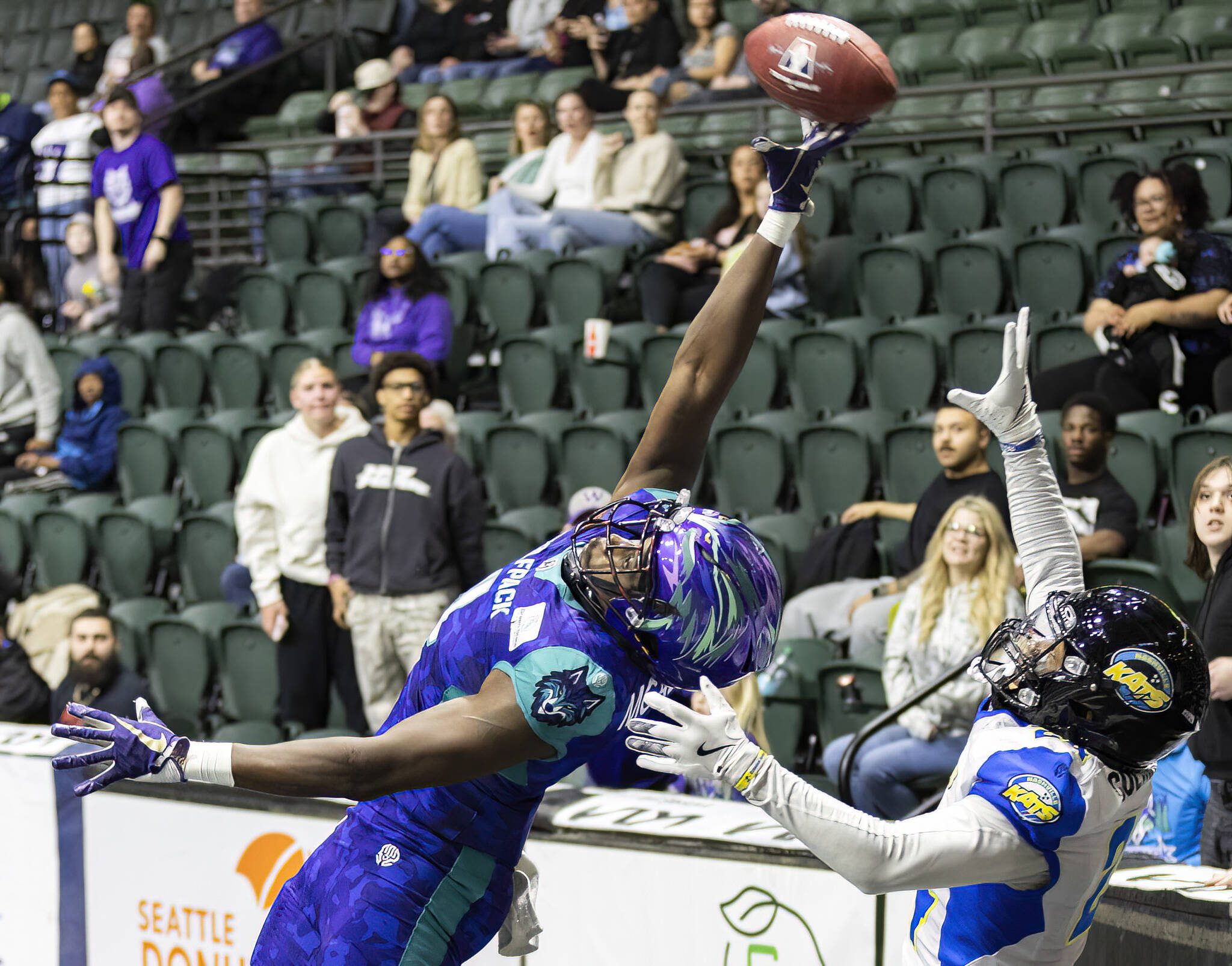 Washington Wolfpack’s Ledarian McAllister reaches up to try and make a catch in the end zone during the game against the Nashville Kats on Thursday, April 17, 2025 in Everett, Washington. (Olivia Vanni / The Herald)