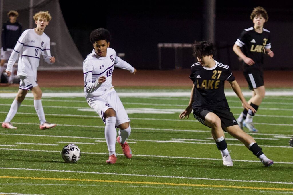 Kamiak freshman Jamil Badru (center left) protects the ball from Lake Stevens sophomore Isaiah Wheeler as Kamiak senior Carter Kjolso and Lake Stevens senior Parks Mickels watch the play unfold during Kamiak’s 2-1 win in Lake Stevens, Washington on April 29, 2025. (Joe Pohoryles / The Herald)
