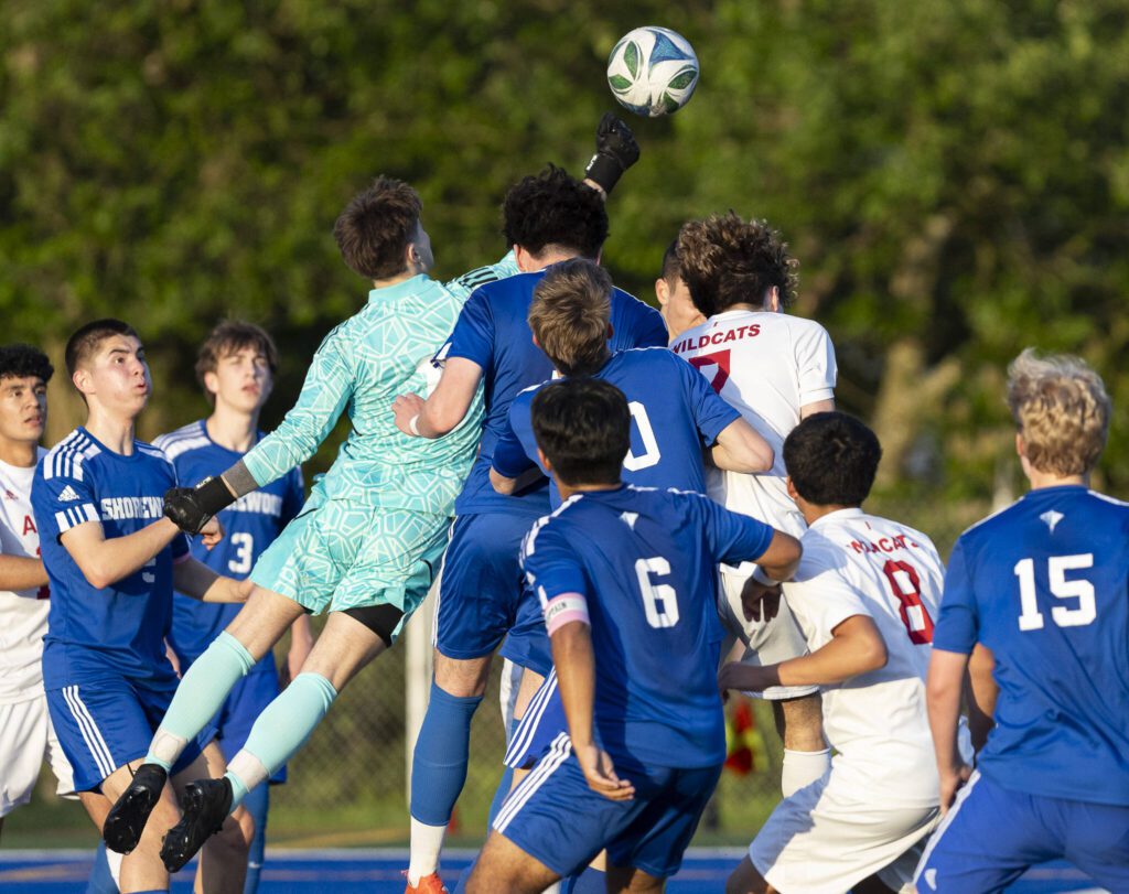 Shorewood’s Ivan Genadiev punches the ball away from the goal during the game against Archbishop Murphy on Wednesday, April 30, 2025 in Shoreline, Washington. (Olivia Vanni / The Herald)
