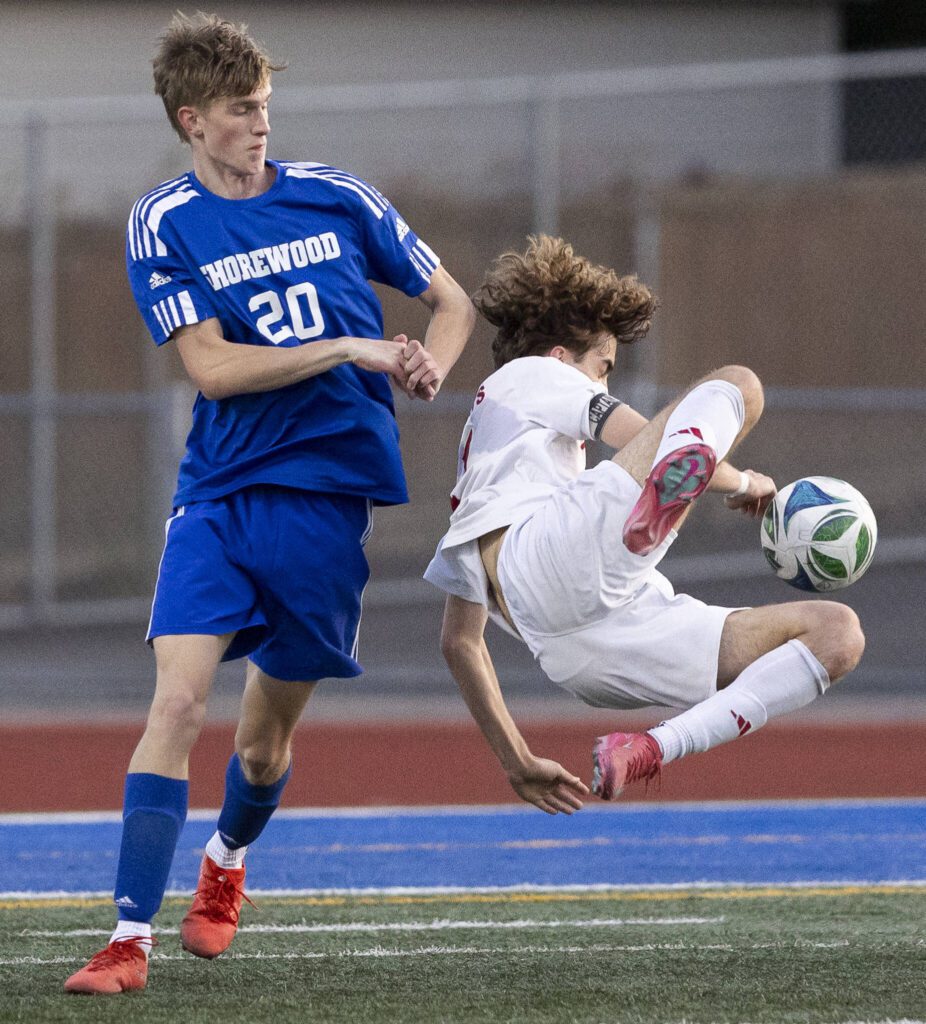 Archbishop Murphy’s Zach Mohr falls to the ground while going after a loose ball during the game against Shorewood on Wednesday, April 30, 2025 in Shoreline, Washington. (Olivia Vanni / The Herald)
