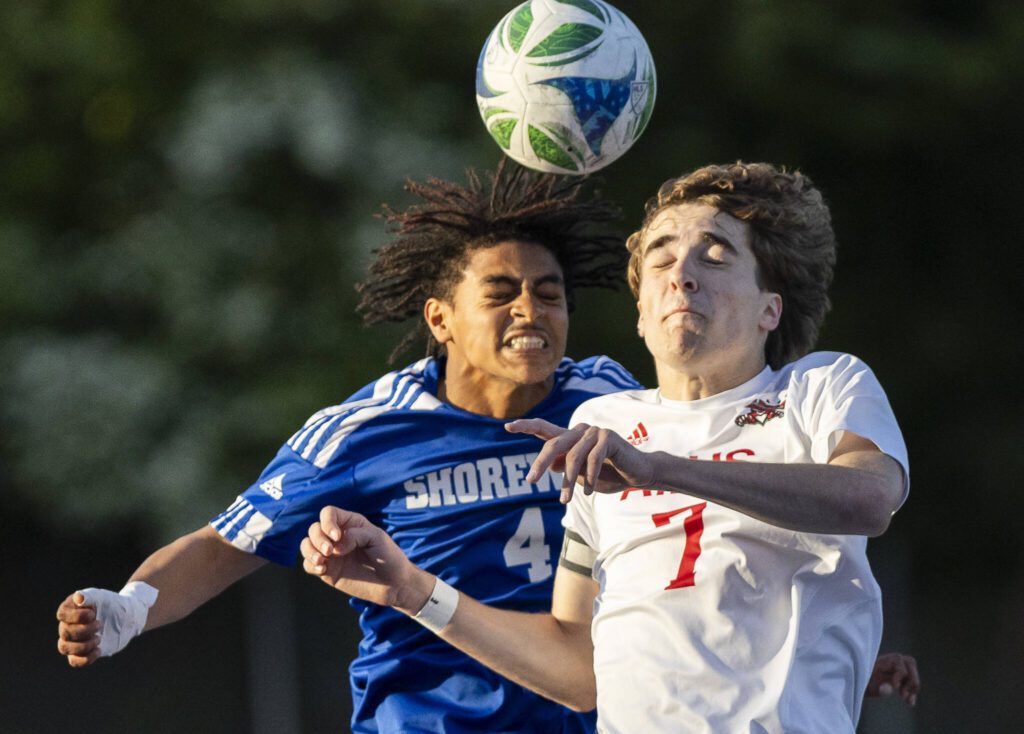 Shorewood’s Meiron Bereket and Archbishop Murphy’s Zach Mohr jump up for a header during the game on Wednesday, April 30, 2025 in Shoreline, Washington. (Olivia Vanni / The Herald)
