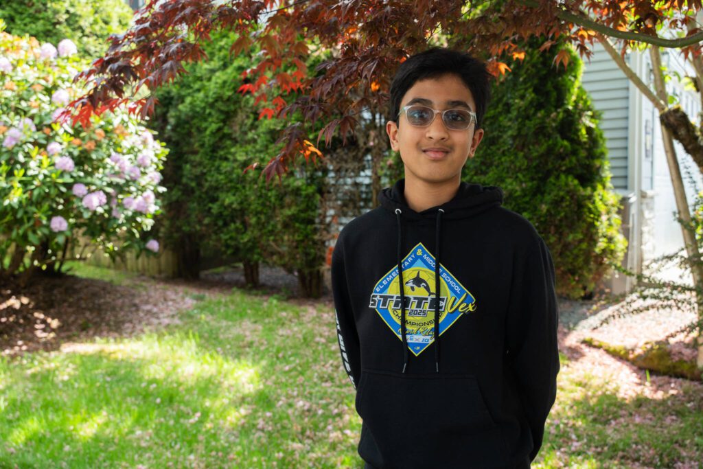 Sarabhesh Saravanakumar, 12, outside his home in Bothell, Washington . (Will Geschke / The Herald)
