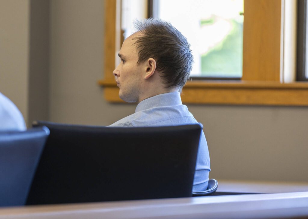 Christian Sayre listens to opening statements at the start of his trial at the Snohomish County Courthouse on Monday, May 5, 2025 in Everett, Washington. (Olivia Vanni / The Herald)
