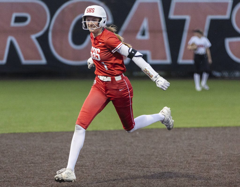 Stanwood’s Megan Stulc smiles as she runs the bases after hitting a home run in extra innings during the game against Monroe on Thursday, May 1, 2025 in Monroe, Washington. (Olivia Vanni / The Herald)
