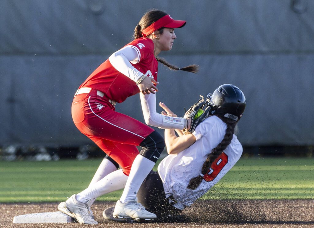 Stanwood’s Rubi Lopez tags Monroe’s Elle Rice as she slides into second base during the game on Thursday, May 1, 2025 in Monroe, Washington. (Olivia Vanni / The Herald)
