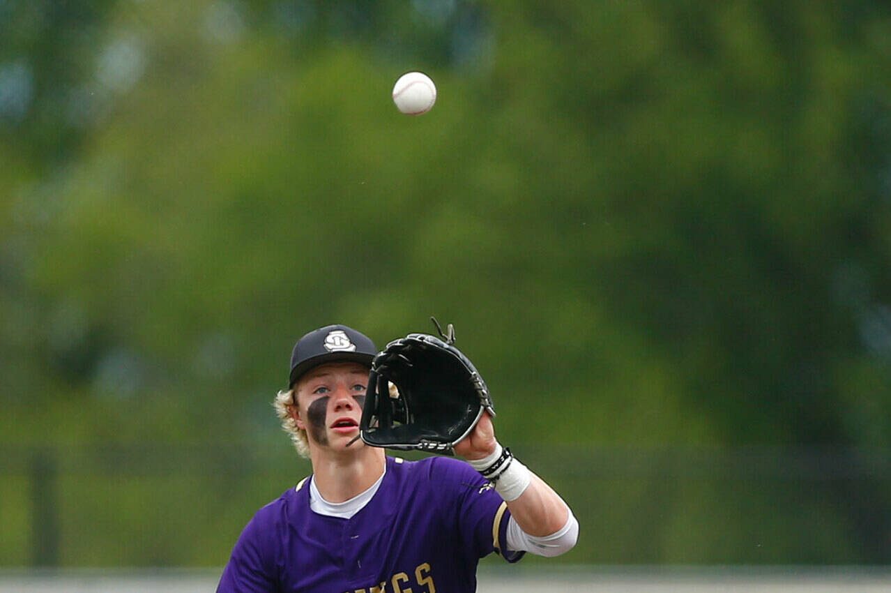 Lake Stevens shortstop Aspen Alexander fields a high chopper behind second base during a playoff loss to Bothell on Saturday, May 4, 2024, in Lake Stevens, Washington. (Ryan Berry / The Herald)