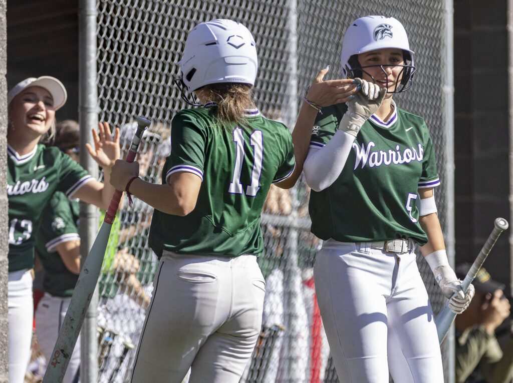Edmonds-Woodway’s Ellie Anderson high-fives teammate Mara Gooch during the game against Archbishop Murphy on Monday, May 5, 2025 in Everett, Washington. (Olivia Vanni / The Herald)
